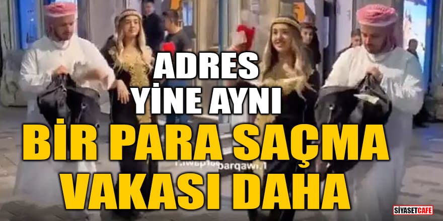 Arap kıyafetli bir kadın ve erkek Taksim'de para dağıttı